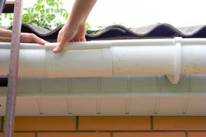 joining two gutter pipes by gutter contractor